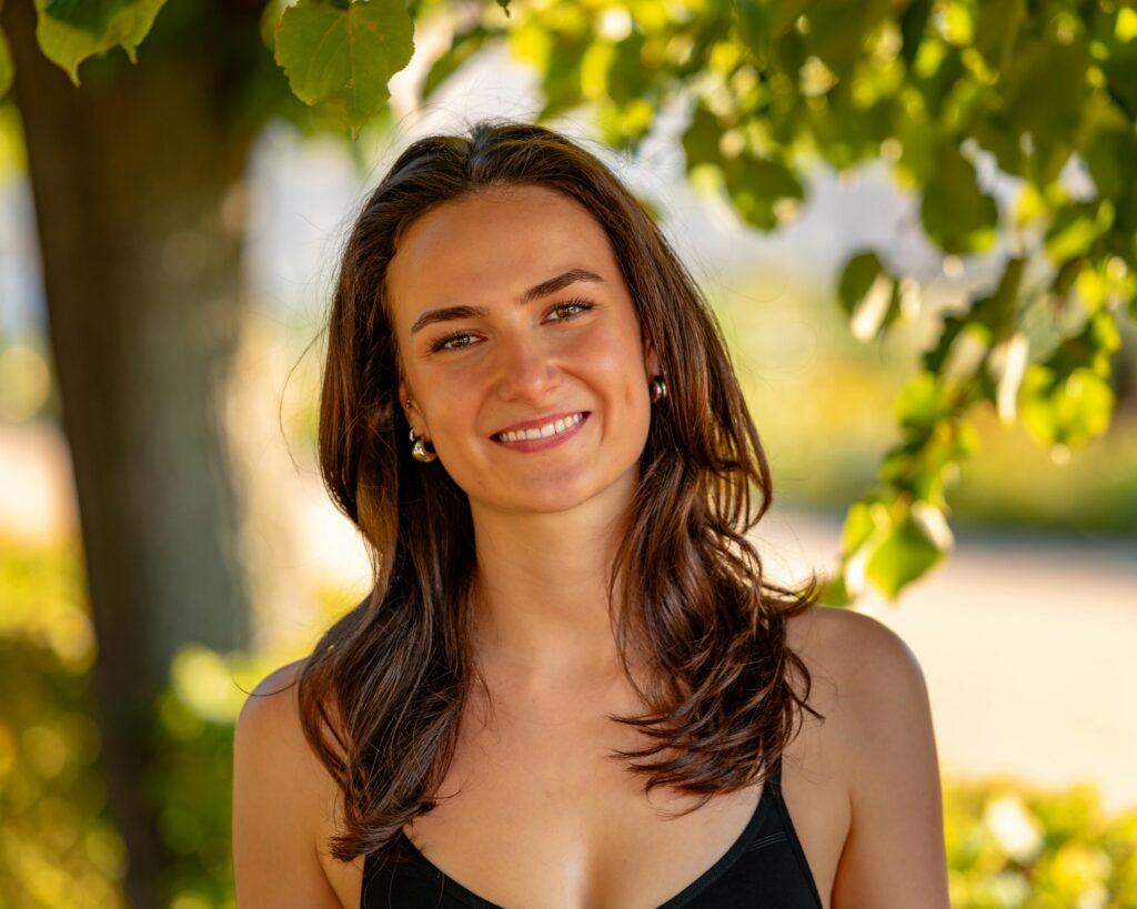If You Want To Look Younger, Start Fixing These 15 Habits First happy woman smiling with less stress to look younger and slow down aging